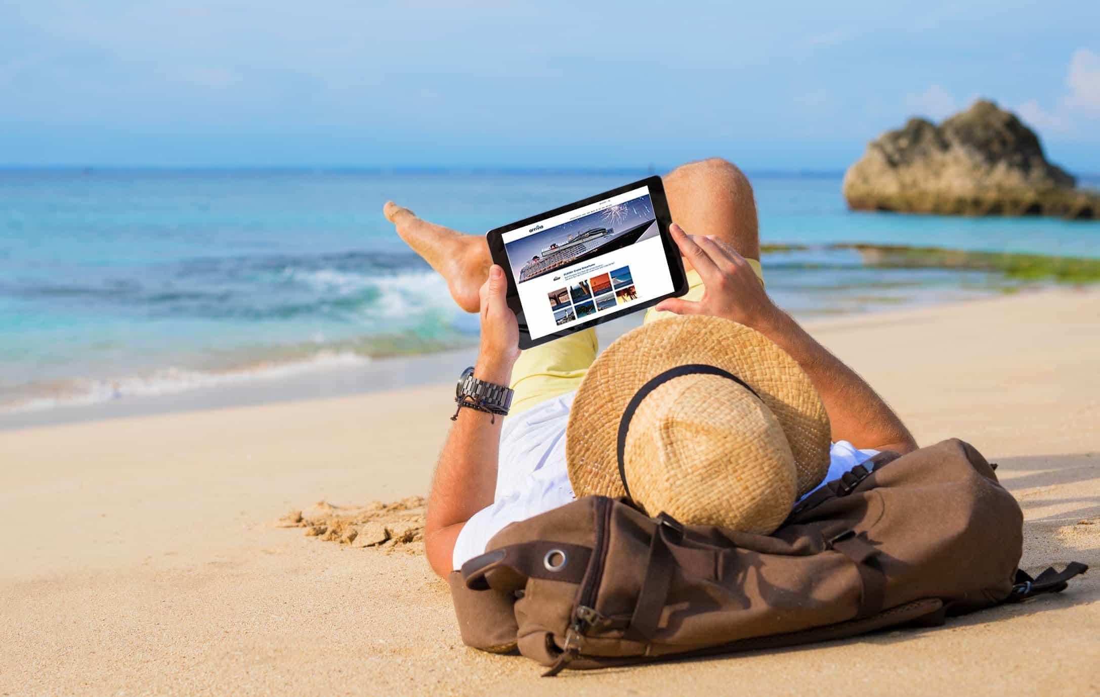 Man booking a vacation on a beach through arrivia’s white label travel platform, highlighting user-friendly experience.
