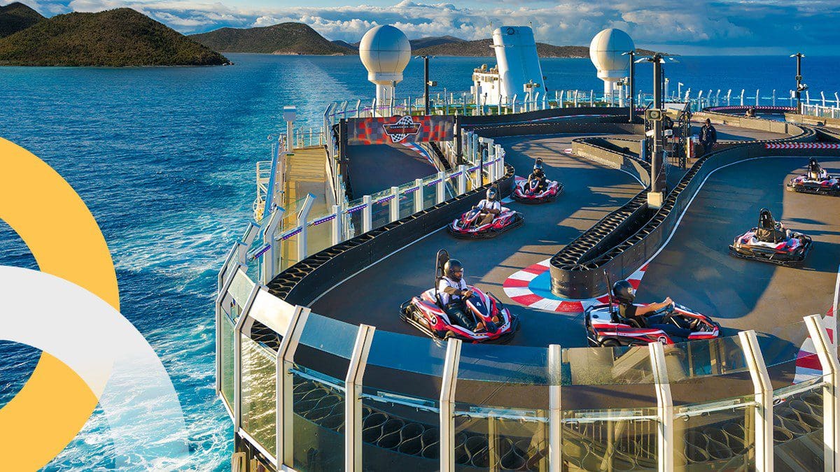 Passengers driving go-karts on the top deck of a cruise ship and enjoying the rebound of cruise travel as the CDC lifts vaccination requirements