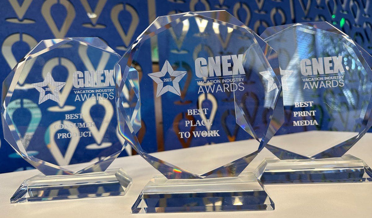 Close-up shot of the 3 industry awards won by arrivia at the 2023 GNEX Vacation Industry Awards