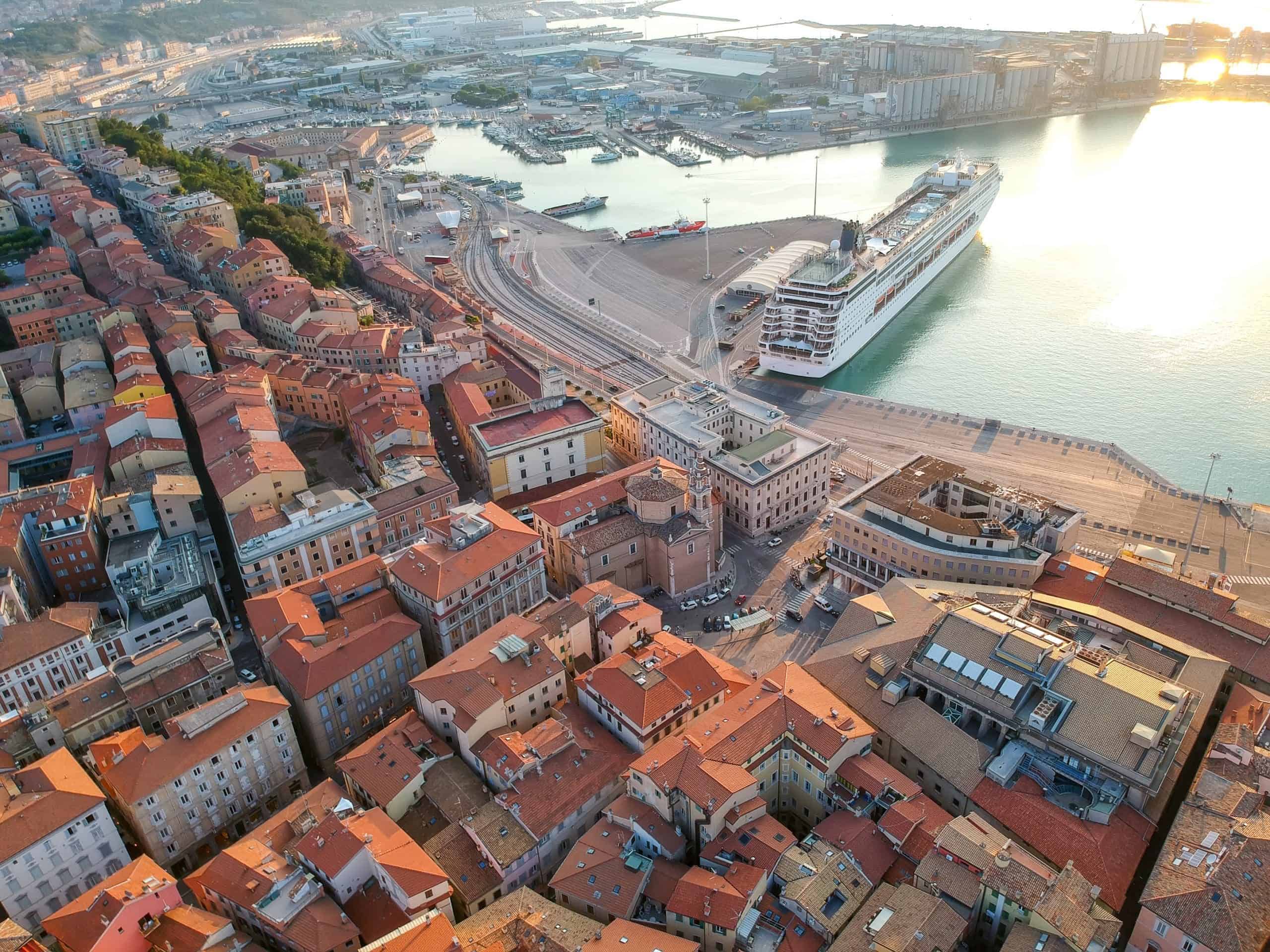  View of a harbor with a docked cruise ship.