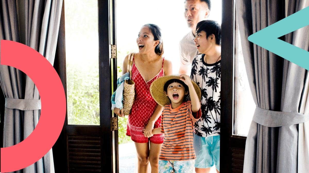 family excited to walk into their hotel room for the first time