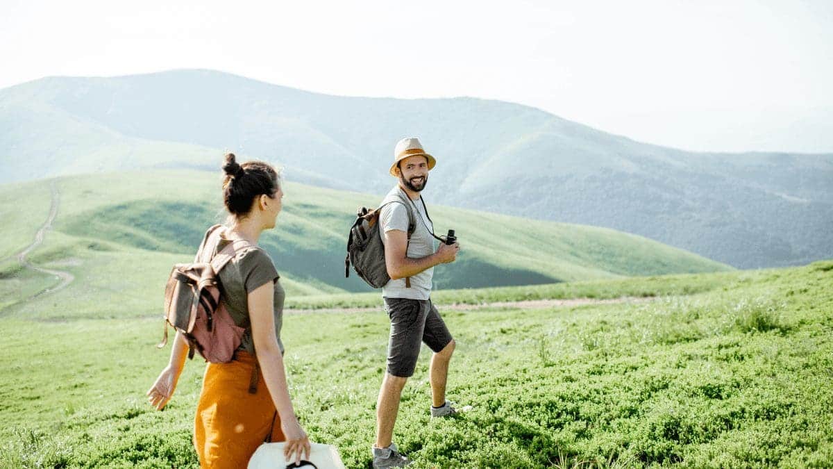 A couple seen on an international vacation booked with a travel loyalty program.