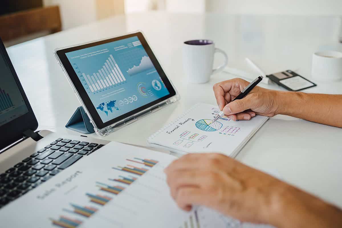 Businessman working on SWOT analysis of a company financial report.