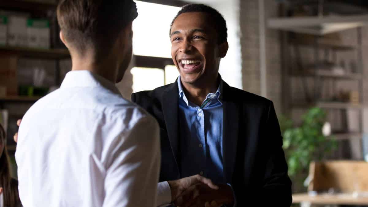 Businessmen discussing perks loyalty program.