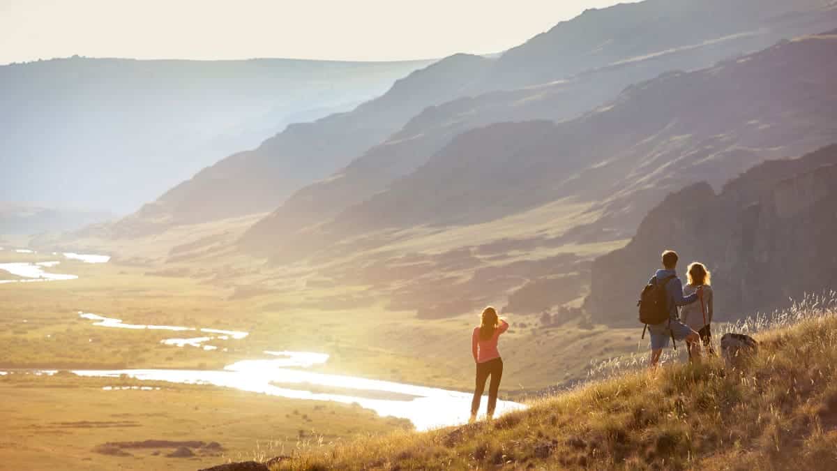 Group of tourists travel mountains view.