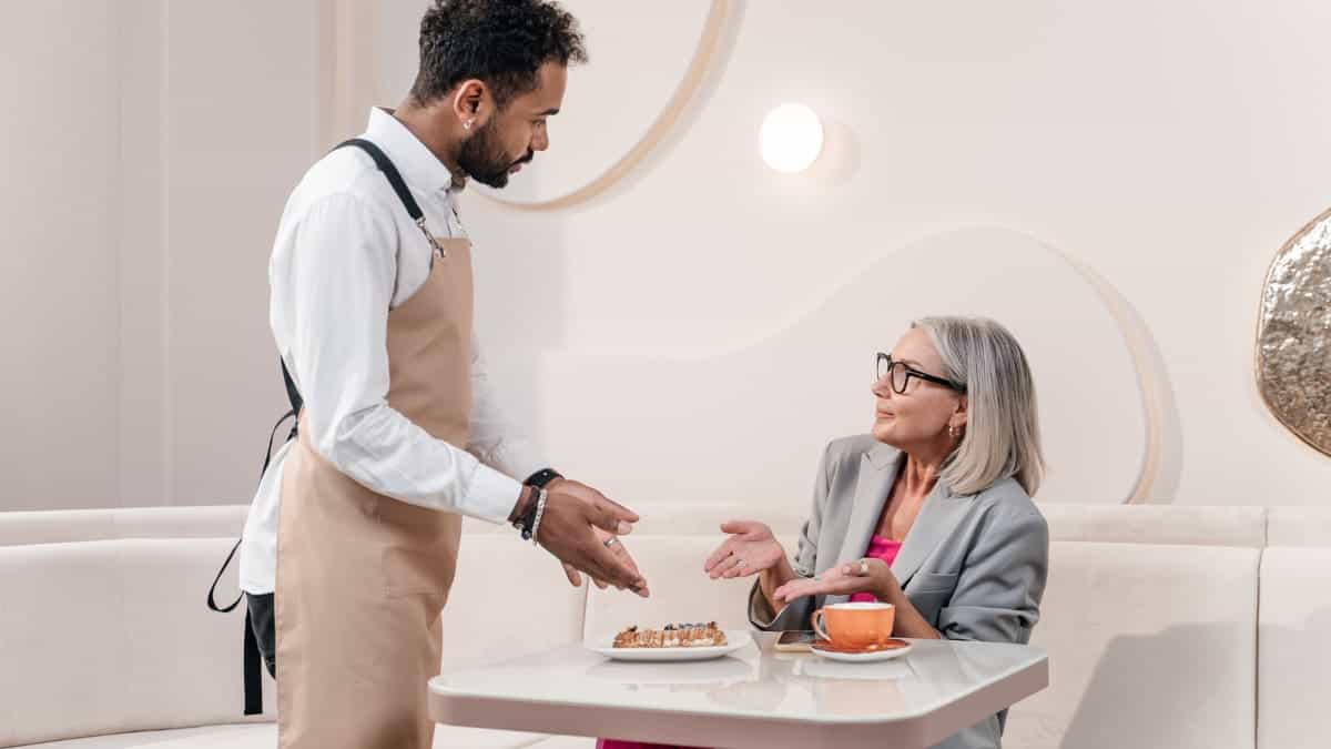 Man speaking with a woman using effective Strategies for Managing Customer Complaints.