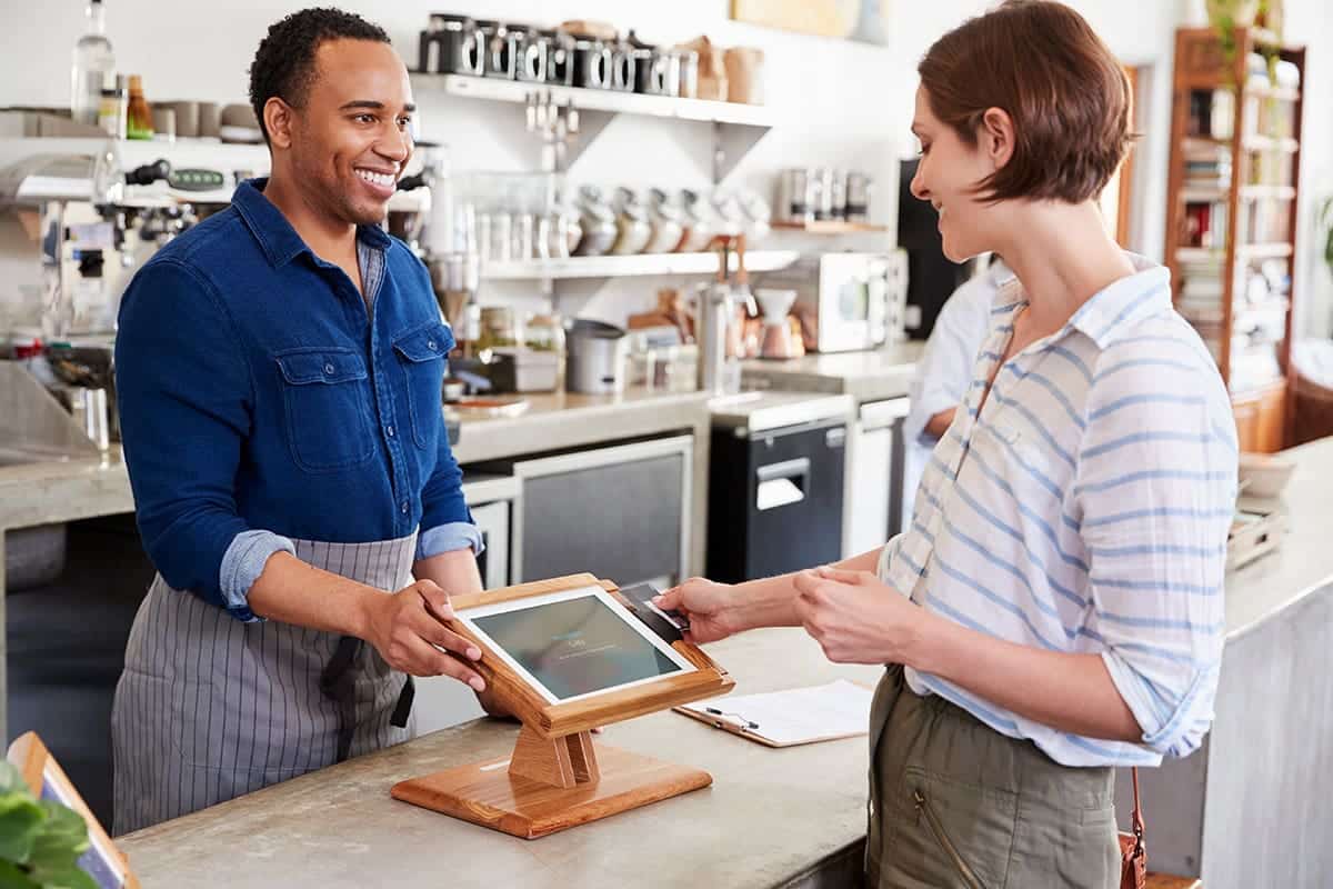 Man speaking with a woman using effective Strategies for Managing Customer Complaints.