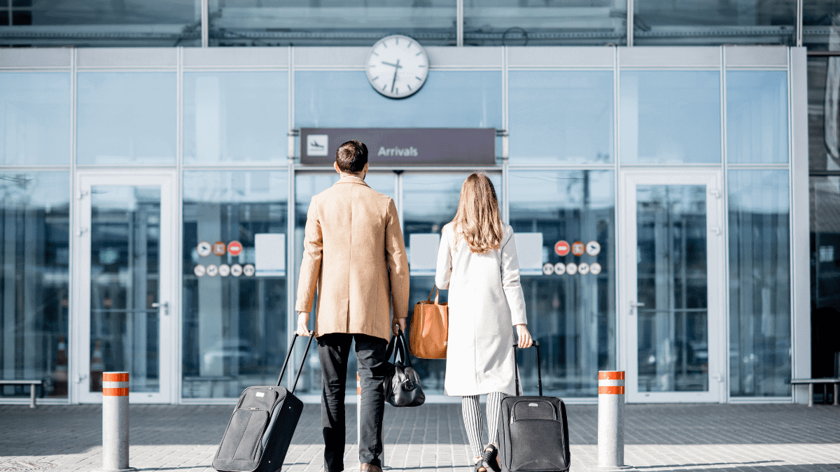 Business Couple Walking to the Airport.