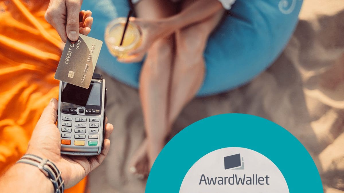 Woman sitting in the sand paying for drink with credit card on wireless handheld terminal after reading arrivia’s 2024 Travel Loyalty Outlook Snapshot report