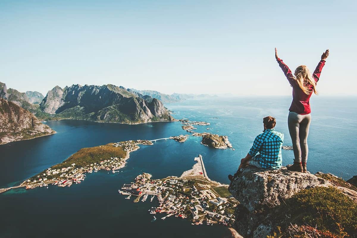 adventurous couple exploring Norway using travel loyalty membership perks
