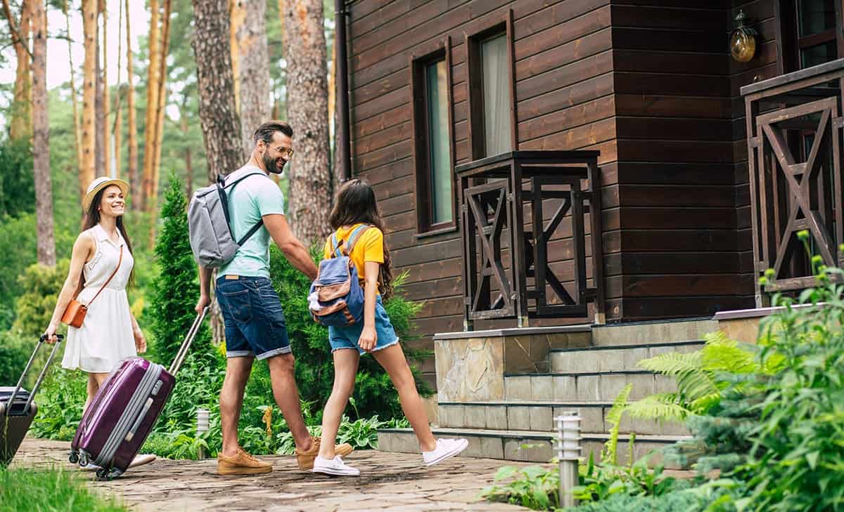 A family arrives at their vacation rental cabin.