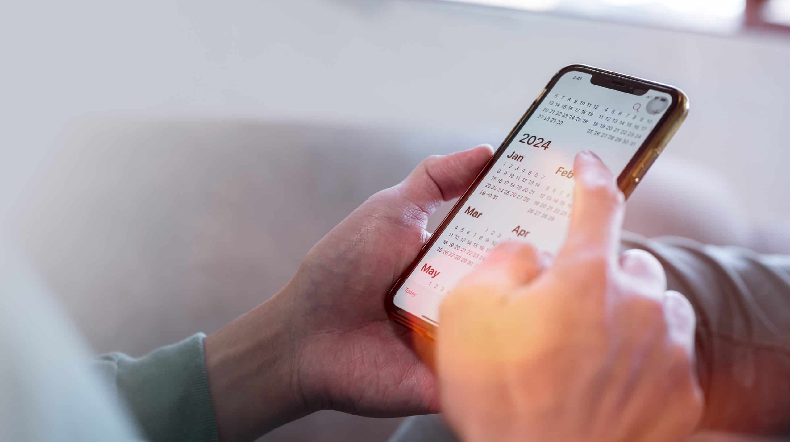 A 2024 calendar displayed on a smartphone screen, showcasing smart travel itinerary management with a digital tool.
