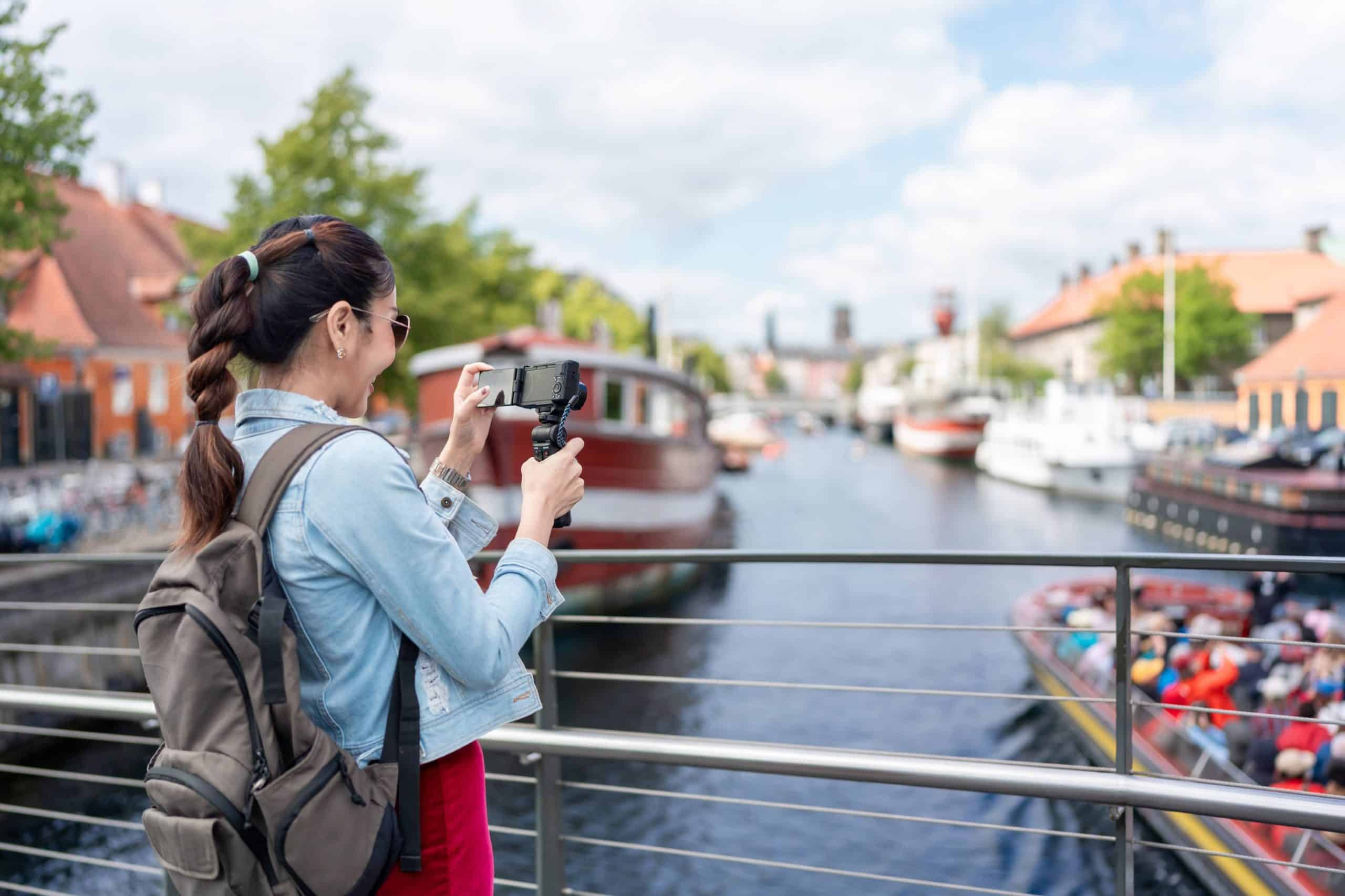 Traveler capturing memories of their trip