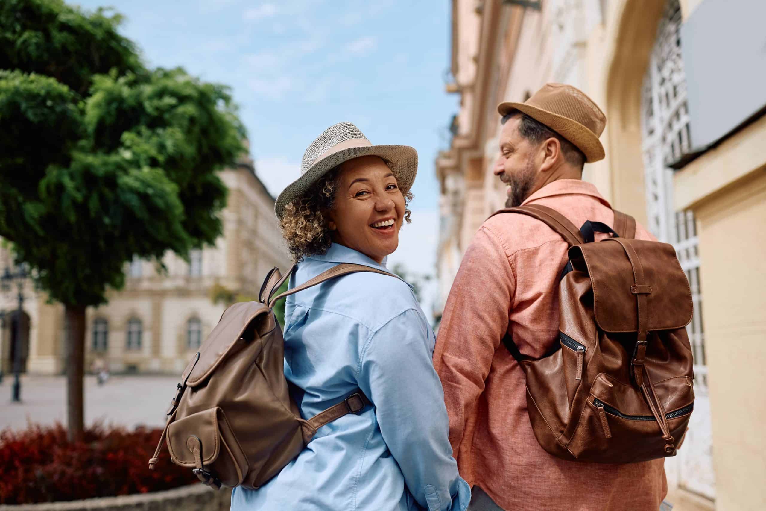 Two happy travelers enjoy a sightseeing walk together