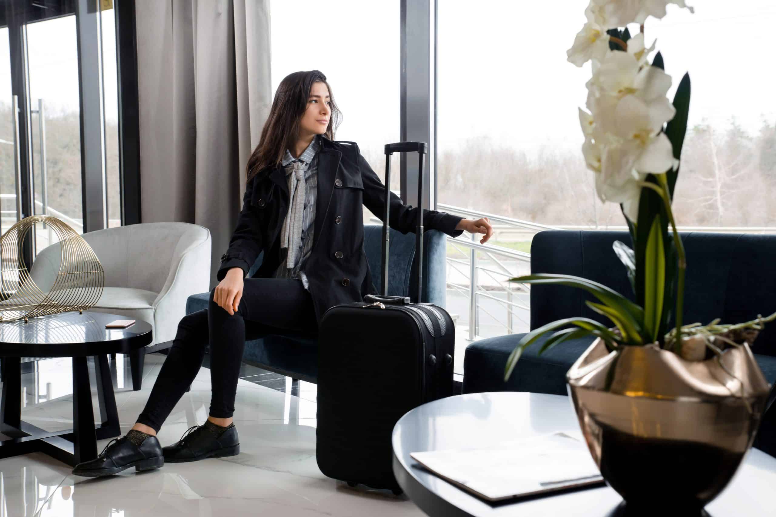 Woman in airport lounge who used loyalty rewards