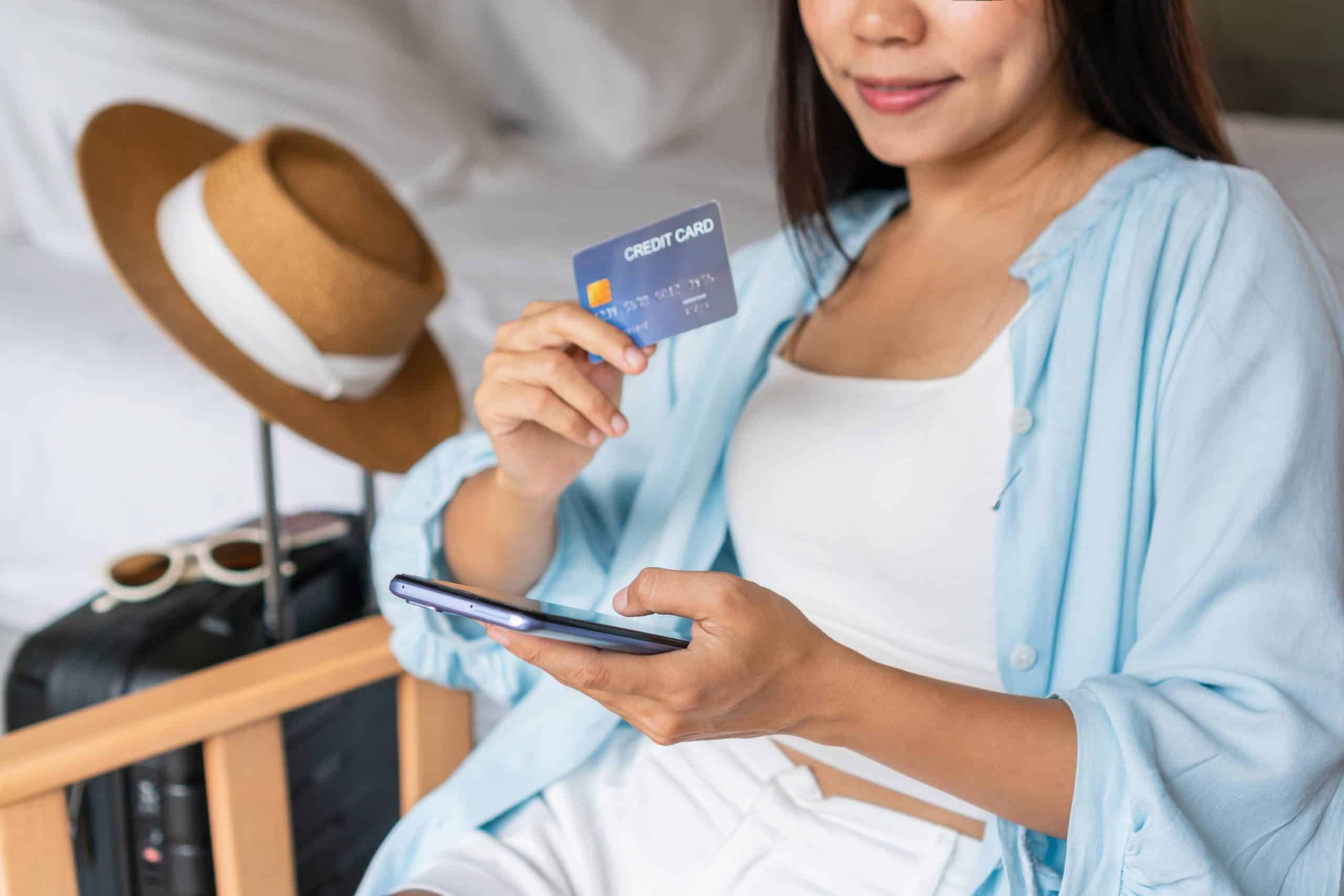 Woman purchasing travel with a credit card