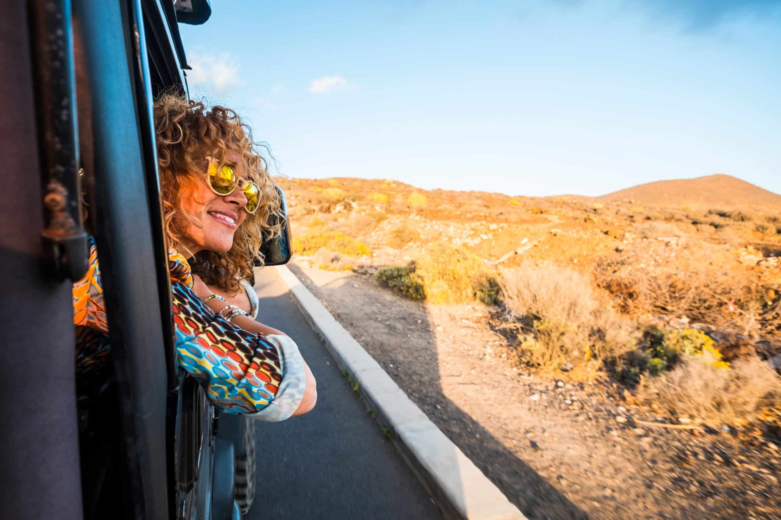 Woman enjoying a scenic roadtrip