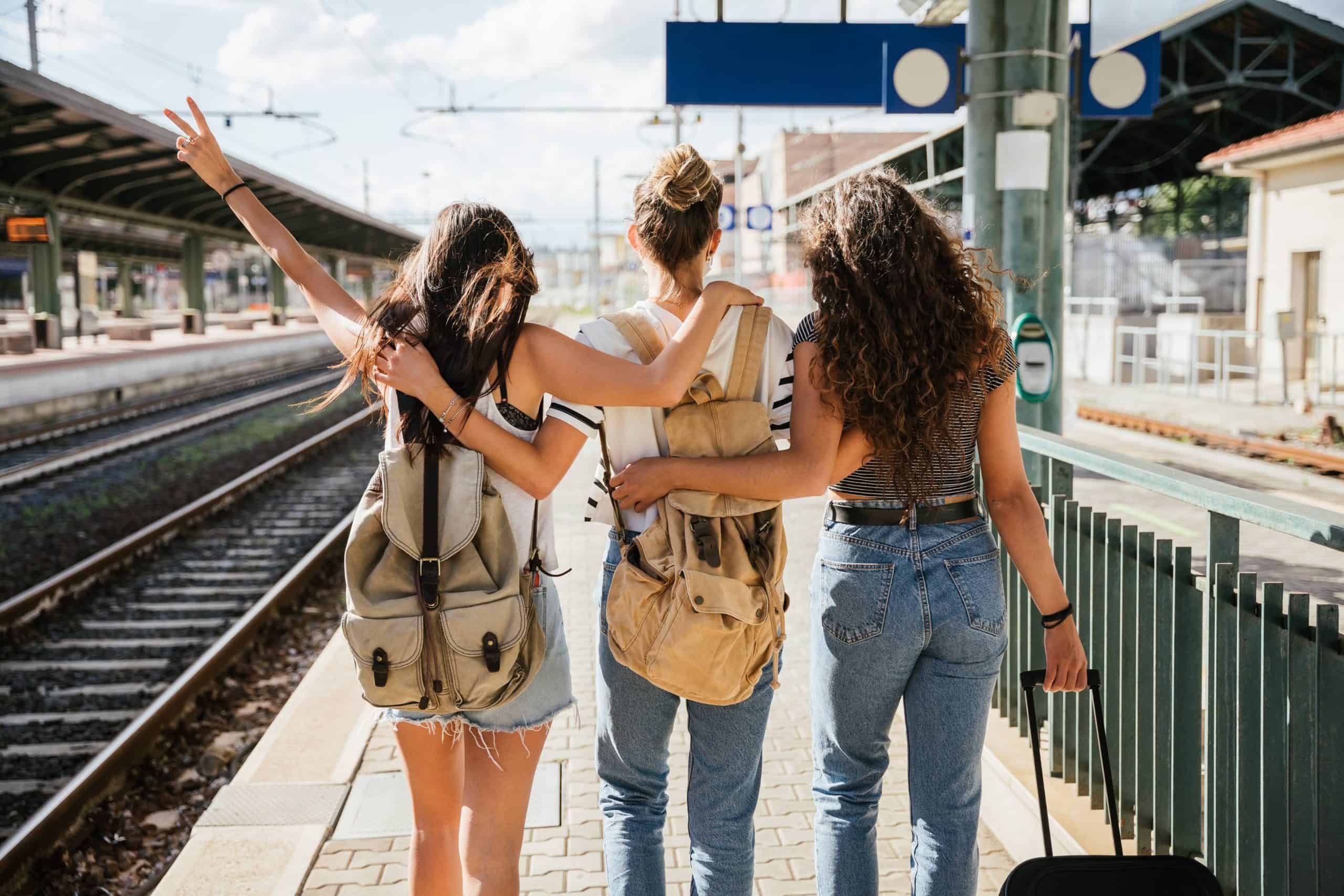 Young girl friends heading on a last-minute trip 