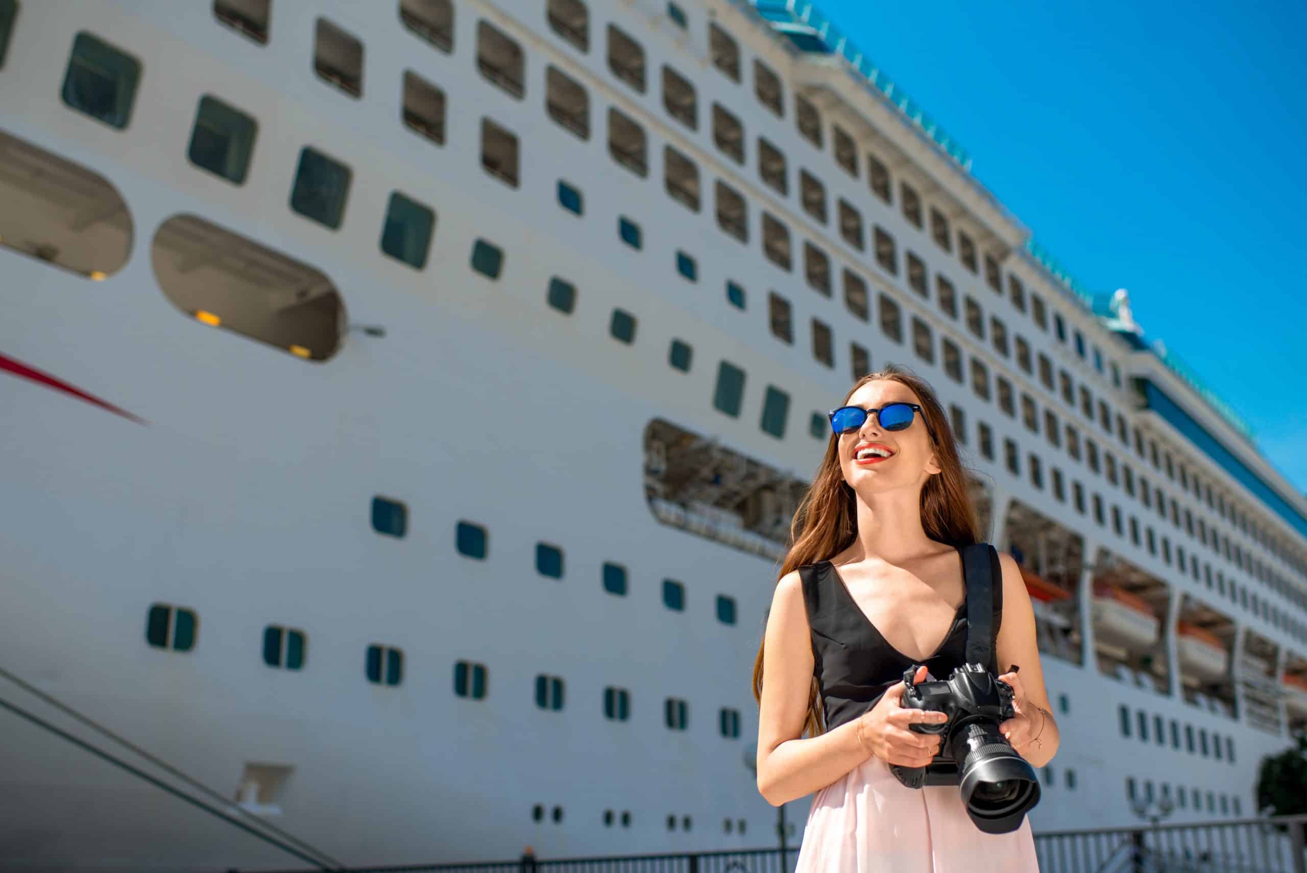 Woman with a camera about to enjoy a cruise