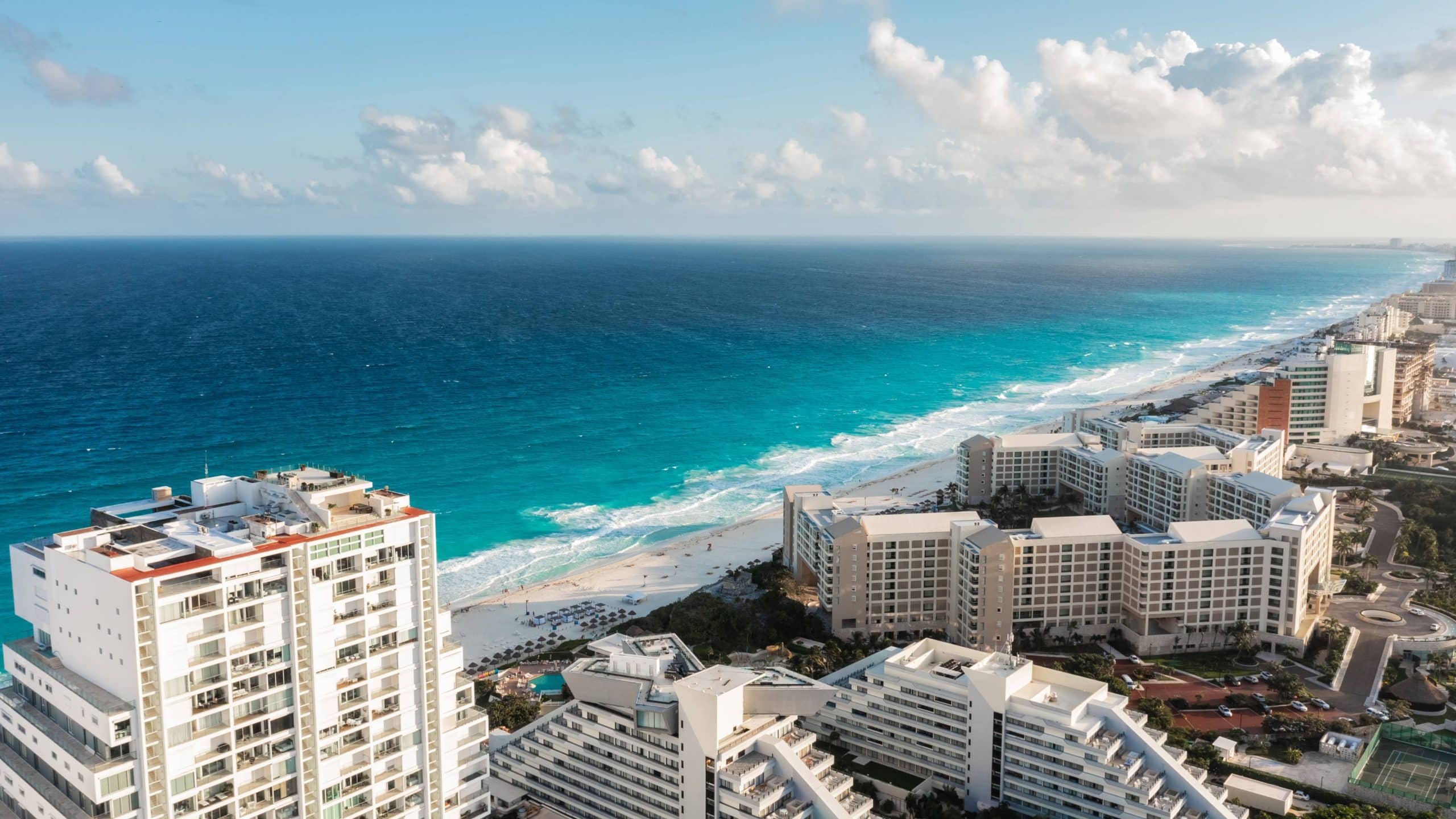 Aerial view of Cancun resort coastline, host city of GNEX-ACOTUR 2025