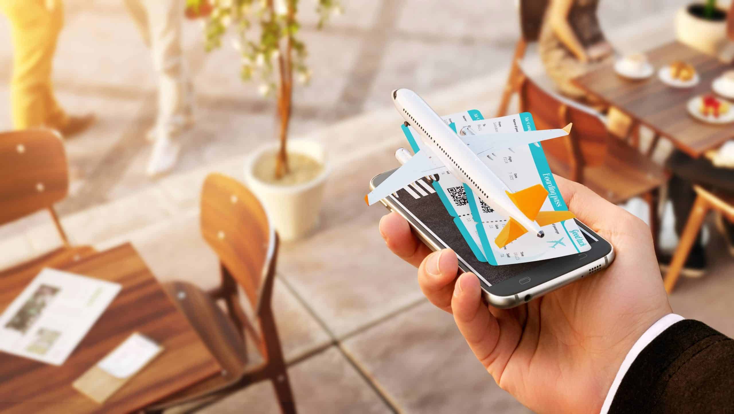 Smartphone displaying airline tickets and a plane illustration representing travel booking and loyalty programs