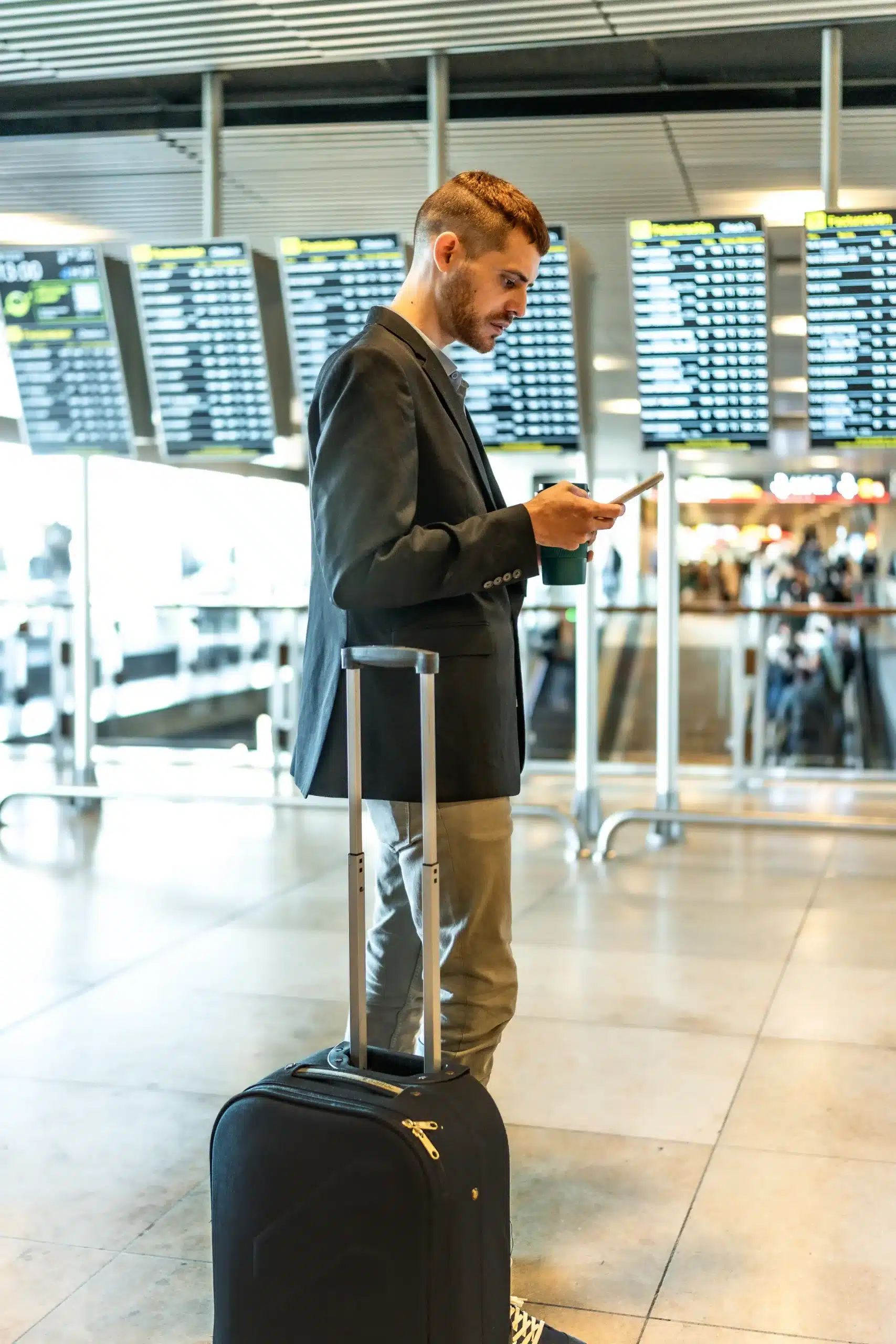 man waiting in check in line