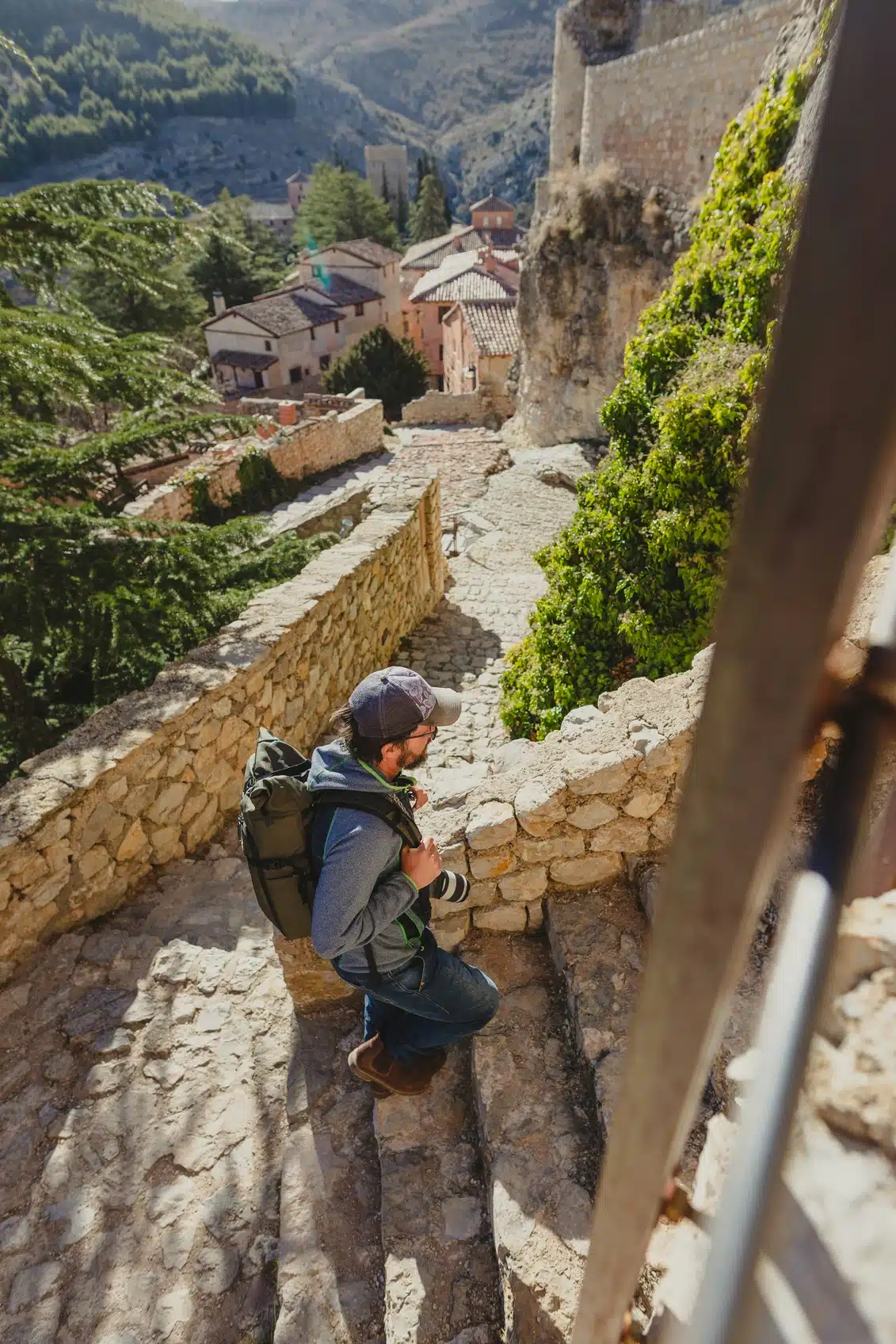 man traveling along cobblestone steps